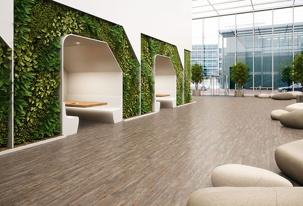 Commercial flooring - an image of a flooring solution in a beautiful and green enhanced lobby area.